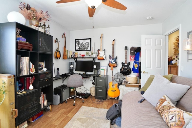 office area with a ceiling fan and wood finished floors