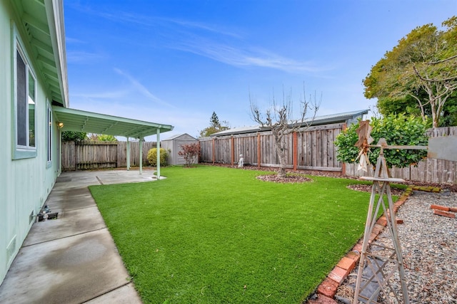 view of yard featuring a patio area and a fenced backyard