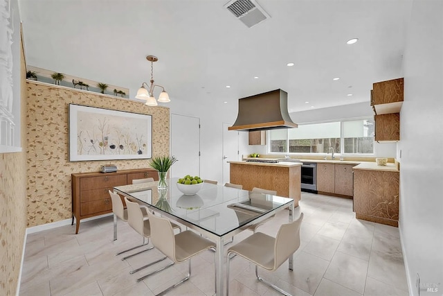 dining area with visible vents, recessed lighting, an inviting chandelier, wallpapered walls, and baseboards