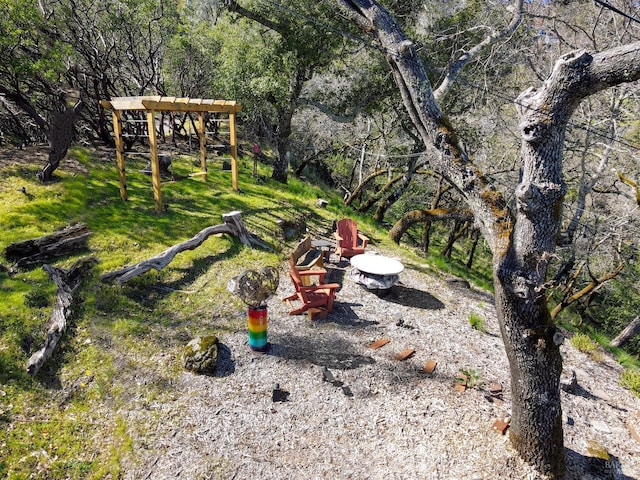 view of yard featuring a fire pit