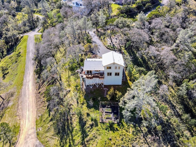 drone / aerial view with a view of trees