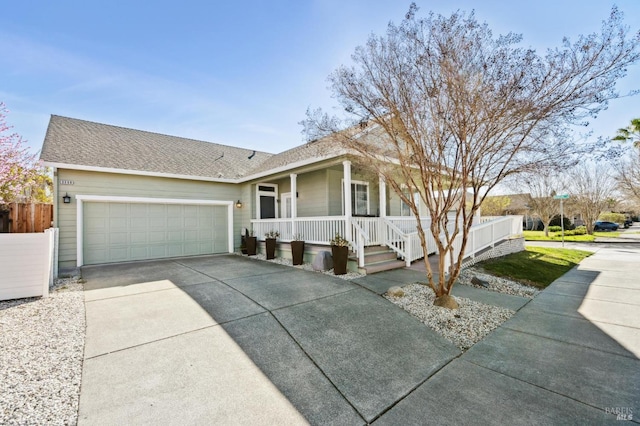 ranch-style home with roof with shingles, covered porch, fence, a garage, and driveway