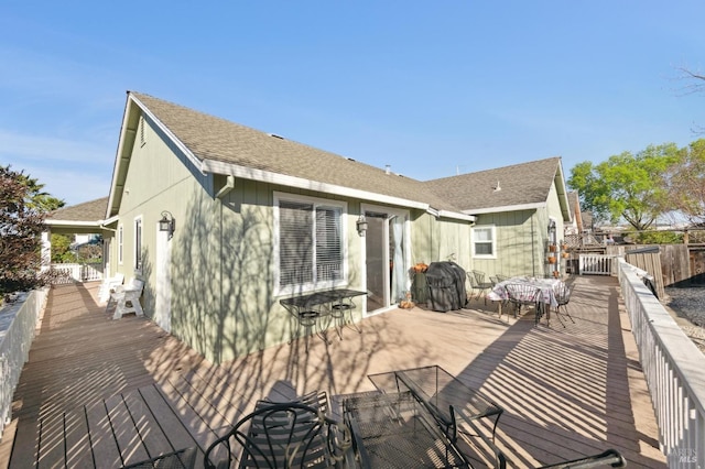 wooden deck featuring outdoor dining area