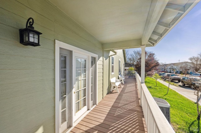 balcony with a residential view and central AC