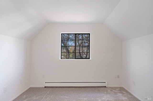 bonus room with vaulted ceiling, a baseboard radiator, carpet flooring, and baseboards