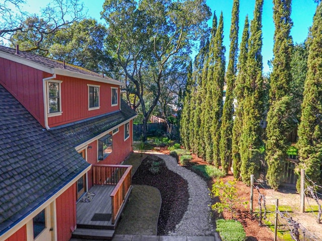 view of side of home with a wooden deck