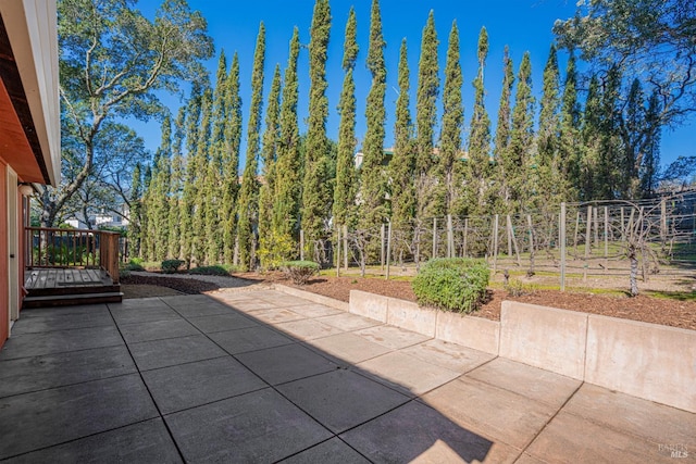 view of patio featuring fence