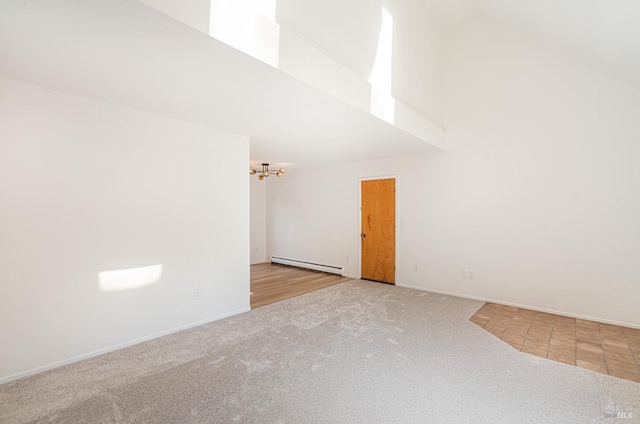 unfurnished room featuring a baseboard heating unit, carpet, high vaulted ceiling, and baseboards