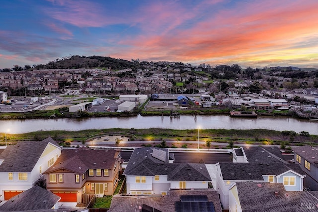 aerial view with a residential view and a water view