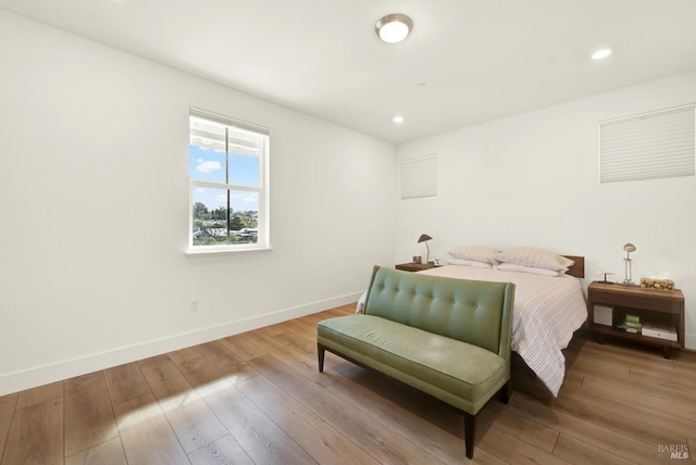 bedroom featuring recessed lighting, baseboards, and hardwood / wood-style flooring