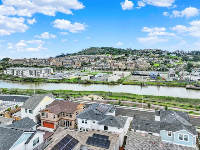 birds eye view of property featuring a residential view and a water view