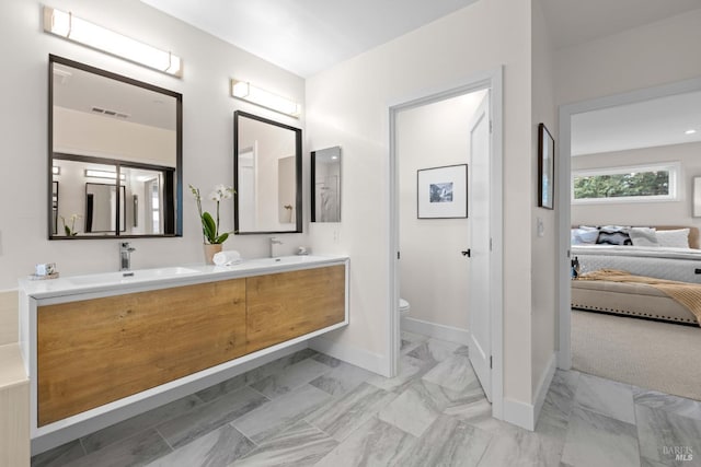 550 Sequoia Dr, San Anselmo, CA 94960 - bathroom featuring a sink, toilet, ensuite bath, and baseboards