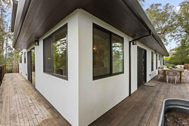 550 Sequoia Dr, San Anselmo, CA 94960 - view of side of home featuring a wooden deck, stucco siding, and outdoor dining area