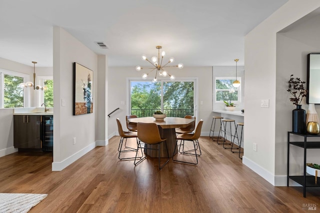 550 Sequoia Dr, San Anselmo, CA 94960 - dining space featuring baseboards, a notable chandelier, and wood finished floors
