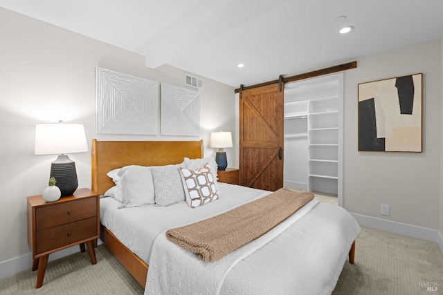 550 Sequoia Dr, San Anselmo, CA 94960 - bedroom with a spacious closet, visible vents, a barn door, light carpet, and baseboards