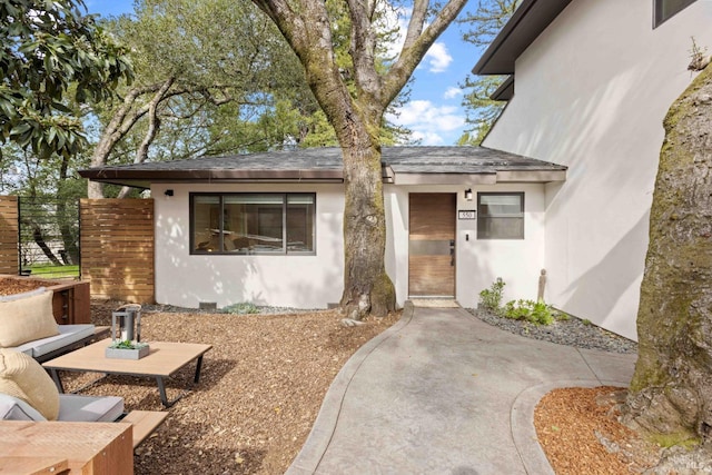 550 Sequoia Dr, San Anselmo, CA 94960 - property entrance with roof with shingles, stucco siding, and fence