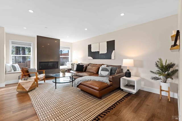 550 Sequoia Dr, San Anselmo, CA 94960 - living room featuring wood finished floors, baseboards, a glass covered fireplace, and recessed lighting