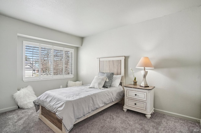 carpeted bedroom with baseboards