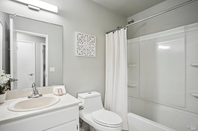 bathroom featuring toilet, shower / tub combo, and vanity