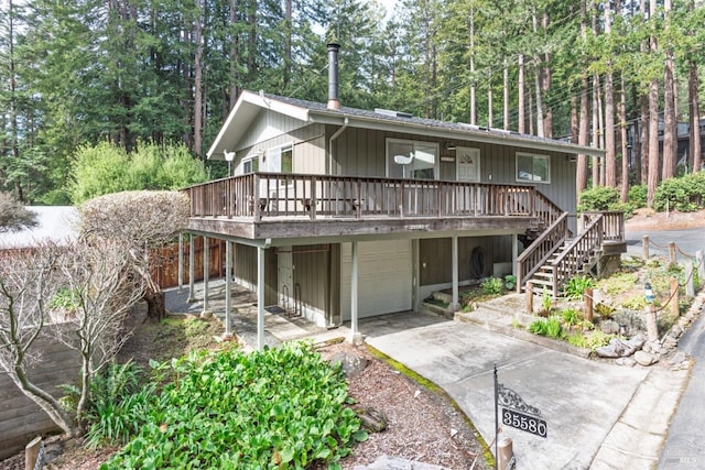 view of front of house featuring stairs, driveway, and an attached garage