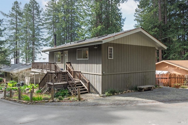 view of front of house with fence and stairs