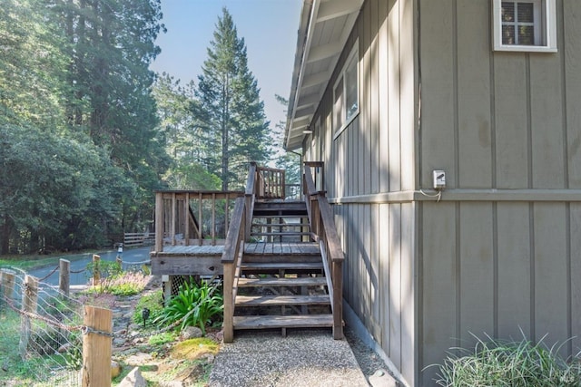 view of home's exterior with stairway and a deck