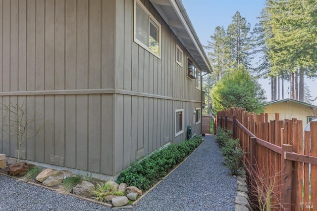 view of property exterior featuring fence