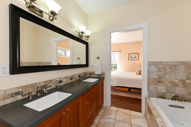 bathroom featuring plenty of natural light, a sink, and tile patterned floors