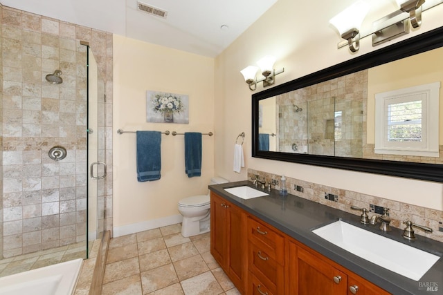 full bathroom featuring decorative backsplash, a sink, visible vents, and a shower stall