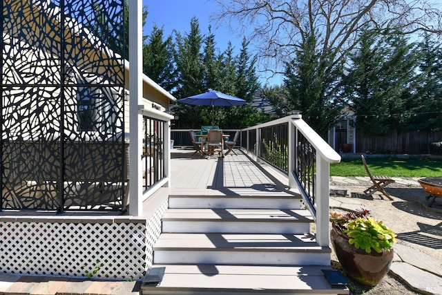 view of patio / terrace with a deck and outdoor dining area