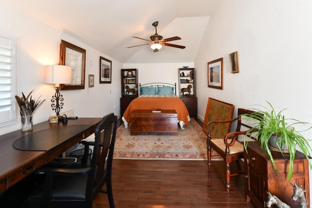 bedroom with vaulted ceiling and wood finished floors