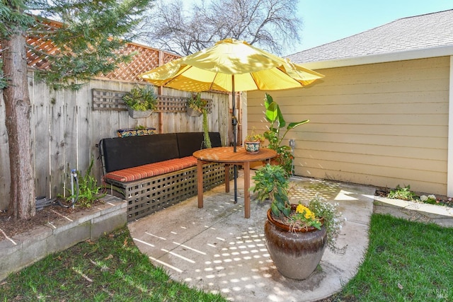 view of patio / terrace featuring fence