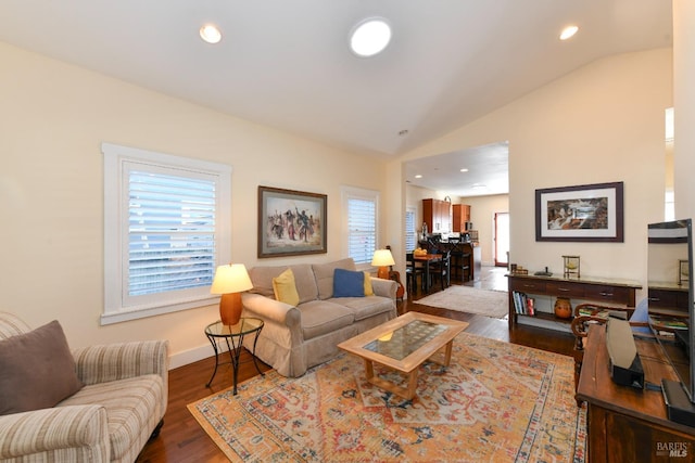 living area with lofted ceiling, baseboards, recessed lighting, and wood finished floors