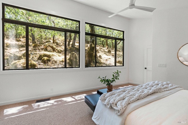 carpeted bedroom with baseboards and visible vents