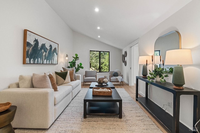 living area with lofted ceiling, wood finished floors, and recessed lighting