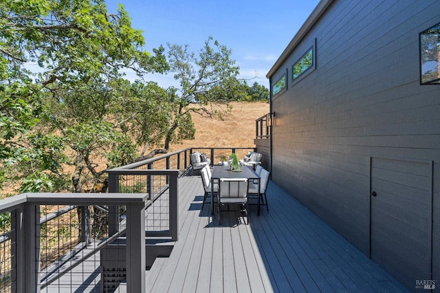 deck featuring outdoor dining space