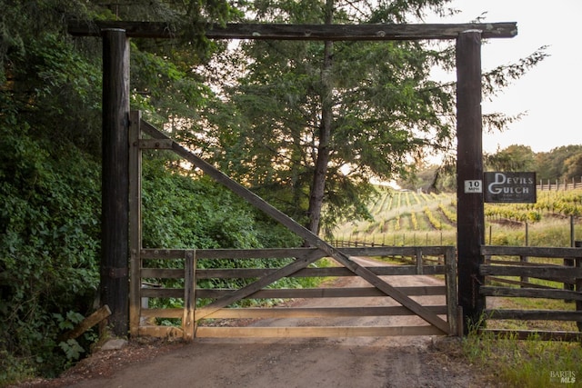 view of gate with fence