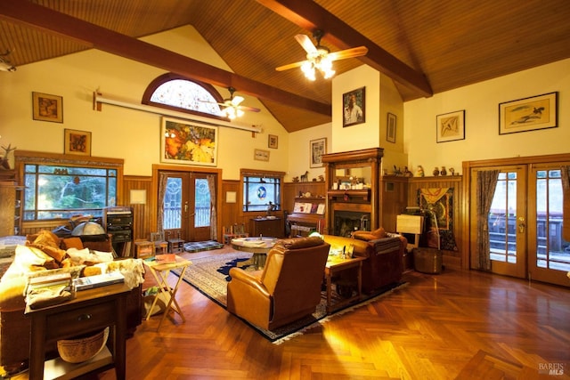 living room featuring french doors, a fireplace, a ceiling fan, high vaulted ceiling, and beamed ceiling