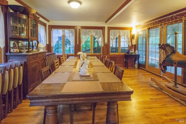 dining room with wainscoting and light wood-type flooring