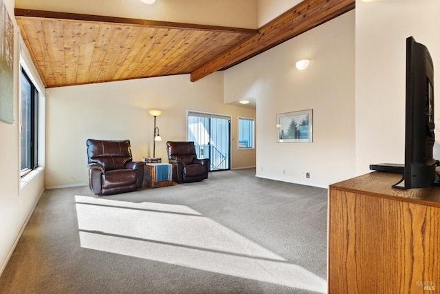 carpeted living room with high vaulted ceiling, wooden ceiling, beam ceiling, and baseboards