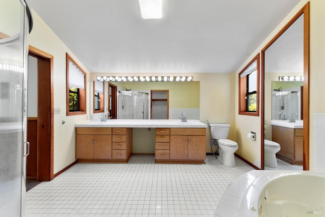 bathroom with a stall shower, tile patterned flooring, vanity, and toilet