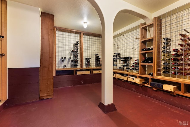 wine room featuring concrete floors