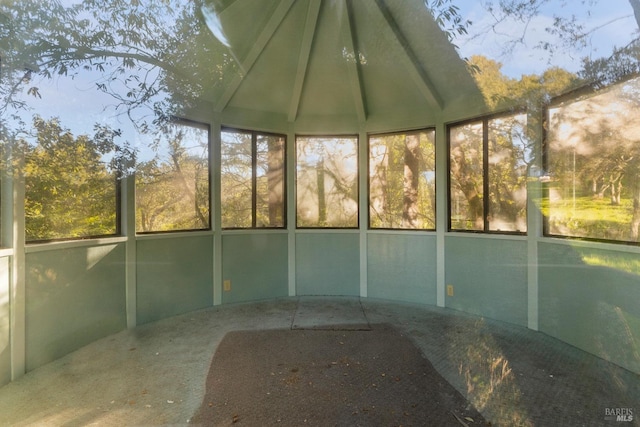 unfurnished sunroom with vaulted ceiling