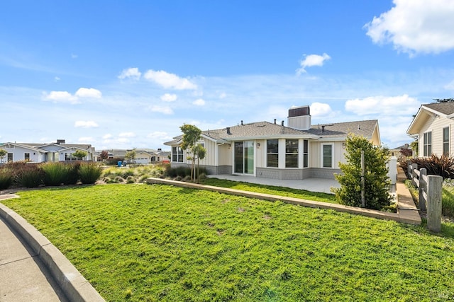 exterior space featuring a yard and a patio