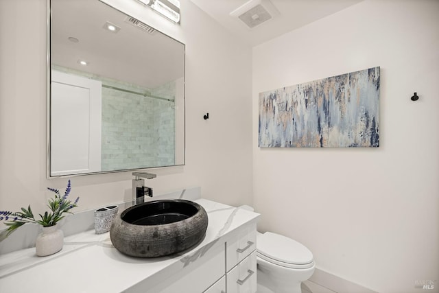 full bath featuring visible vents, toilet, walk in shower, and vanity