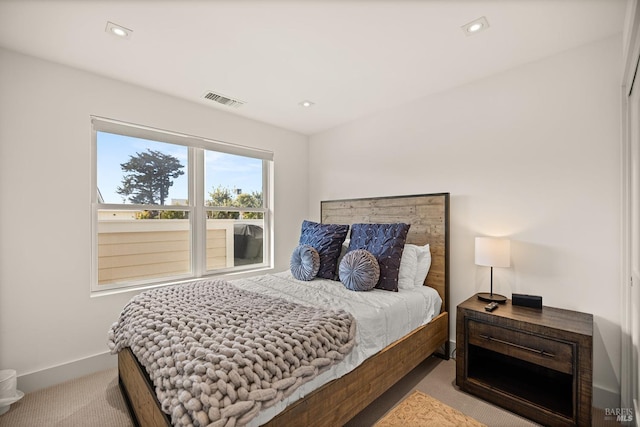 bedroom featuring recessed lighting, visible vents, baseboards, and carpet