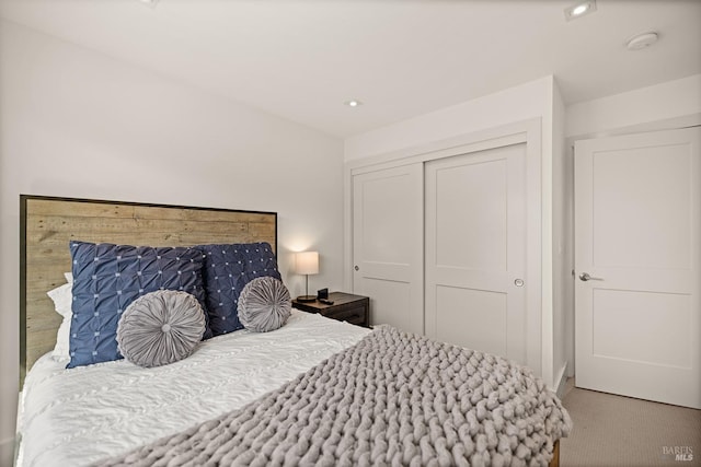 bedroom with a closet and carpet