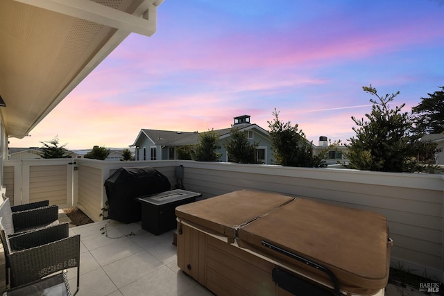 view of patio featuring a grill and a hot tub