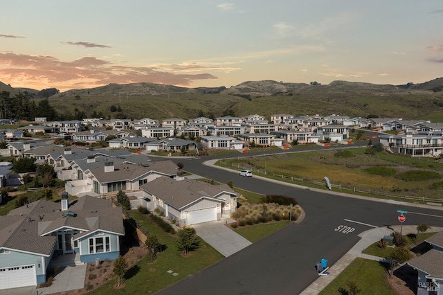 aerial view at dusk with a residential view and a mountain view