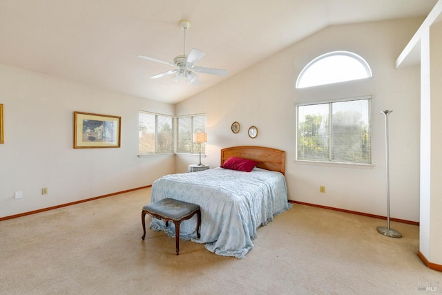 carpeted bedroom featuring high vaulted ceiling, ceiling fan, and baseboards